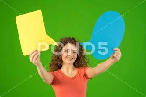 The woman stand and hold a dialog signs on the green background Stock Photos