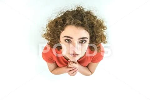 The woman stand and look to the camera. View from above Stock Photos
