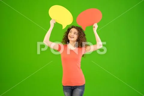 The woman stand with a dialog signs on the green background Stock Photos