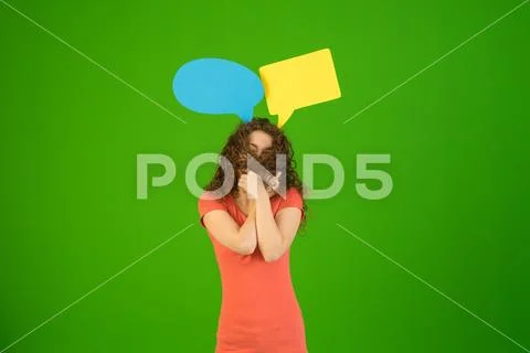 The woman stand with dialog signs on the green background Stock Photos