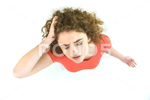 The woman stand on the green background. View from above Stock Photos