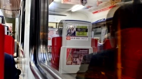 Woman stand up. Look in the reflection of a window train Stock Footage 58492308