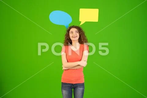 The woman stand near dialog signs on the green background Stock Photos