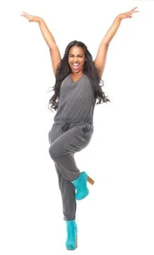 Woman standing with arms raised and happy expression Stock Photos
