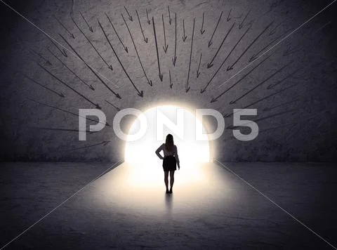 Woman standing in front of the huge gate Stock Photos
