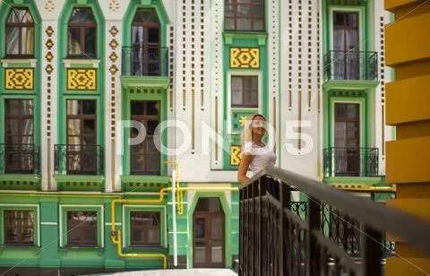 Woman standing near a beautiful building Stock Photos