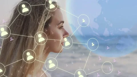 Woman standing shore, node appearing near ear and spanning across hair to globe 動画素材 333575389