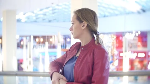 A woman is standing in a store Stock Footage 84572273