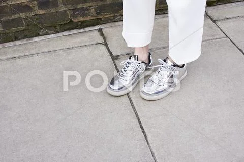 Woman Standing In Street Wearing Silver Shoes, Detail