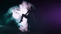 The woman standing in twine on a smoke cloud background. slow motion 4k or 4k+ Resolution