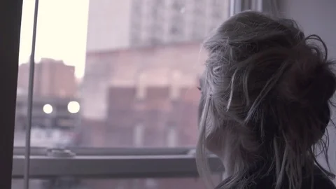 Woman Standing By Window 動画素材 71304430