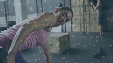 Woman starting bent forward, pulling hex dumbbell toward torso for fitness, Stock Footage 323431525