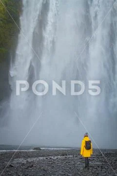 Woman stay on waterfall in Iceland, hide waterfall in Iceland, a Stock Photos