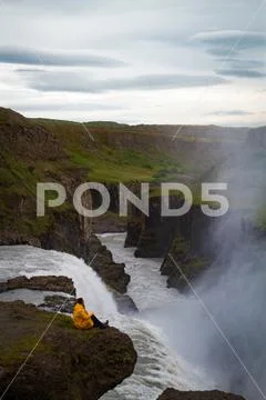 Woman stay on waterfall in Iceland, hide waterfall in Iceland, a Stock Photos
