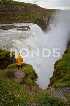 Woman stay on waterfall in Iceland, hide waterfall in Iceland, a Stock Photos