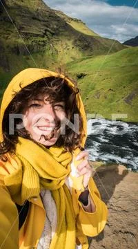 Woman stay on waterfall in Iceland, hide waterfall in Iceland, a Stock Photos