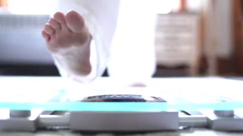 Woman Steps On Scale Stock Footage 56680147