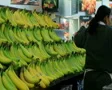 Woman Stocking Bananas SD Footage