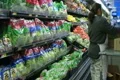 Woman Stocking Lettuce In Produce Footage