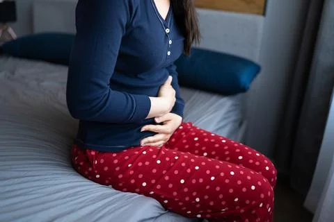 Woman With Stomach Pain Stock Photos