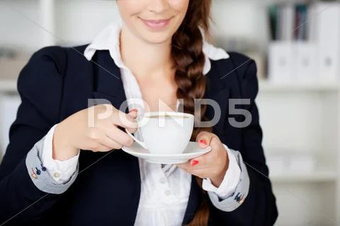 Woman stopping for a coffee break Stock Photos