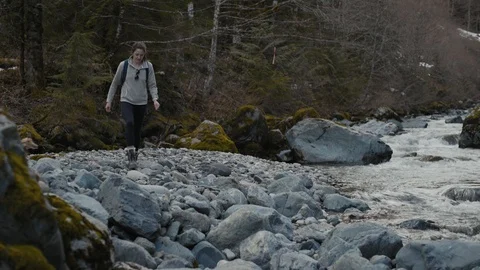Woman stops to take in view at Stream in the Northwest of Washington Stock Footage 88798530