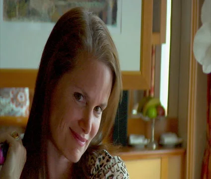 Woman straightens hair Smiling Stock Footage