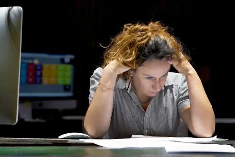 Woman in stress in front of computer Stock Photos