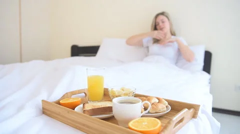 Woman stretching in bed after wake up Stock Footage 59223199