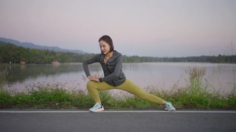 Woman stretching before exercise Stock Footage 170590819