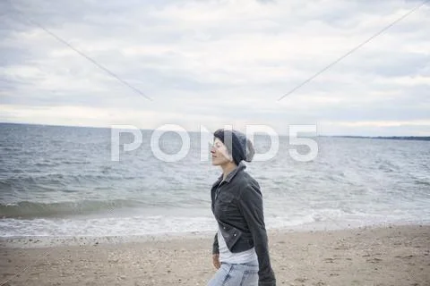 Woman Strolling On Beach, Long Island, Brooklyn, New York, Usa