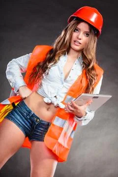 Woman structural engineer with tablet working. Stock Photos