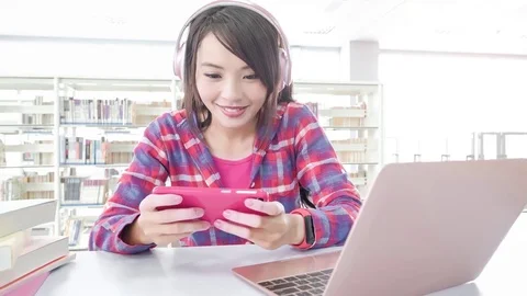 Woman student in the libray Stock Footage 83229730