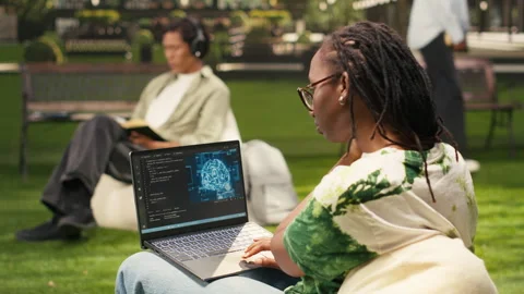 Woman student using binary code and artificial intelligence on laptop Stock Footage 340961678