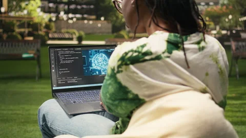 Woman student using binary code and artificial intelligence on laptop Stock Footage 340963304