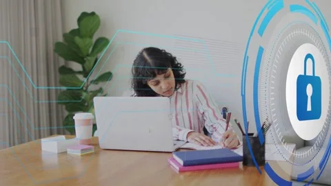 Woman student writing notes at table while lock rising over laptop and blue Stock Footage 334703718