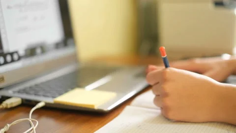 Woman studying at home while use notebook for remote schooling,covid-19 pandemic Stock Footage 151656895
