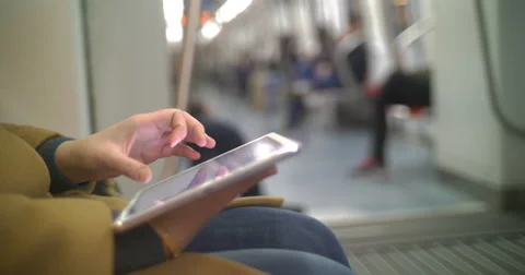 Woman in subway train using tablet PC Stock Footage 52008154