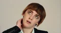 Woman suffering with a stiff or sore neck HD Footage