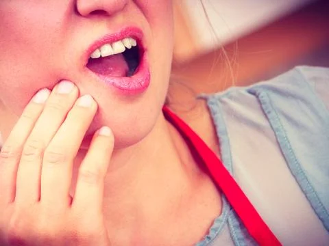 Woman suffering from toothache tooth pain. Stock Photos
