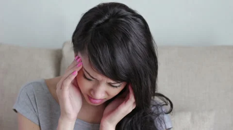 Woman suffers from headache, migraine, stress, hangover Stock Footage