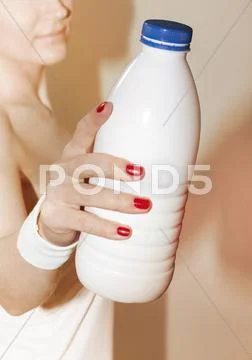 Woman suggests to take bottle Stock Photos