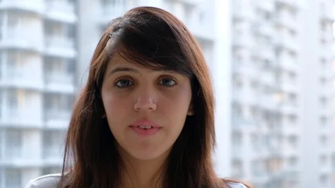 Woman is surprised while looking towards the camera on surprising good news  Stock Footage 100618321