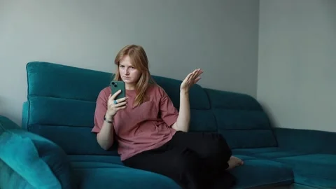 Woman surprised while reading a message on phone. Stock Footage 287502993