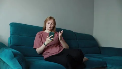 Woman surprised while reading a message on phone. Stock Footage 287503003