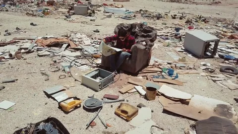 Woman surrounded by garbage Stock Footage 84671399