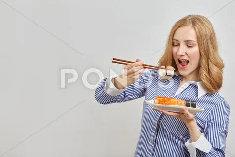 Woman with sushi Stock Photos