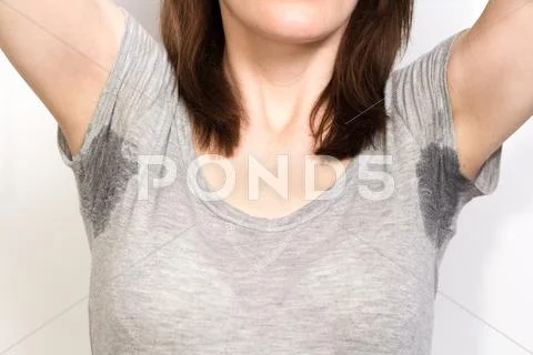 Woman sweating very badly under armpit Stock Photos