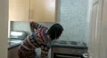 Woman sweeping kitchen in a hurry HD Footage