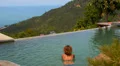 Woman Swimming in Endless Swimming Pool against Amazing Seascape. HD Footage